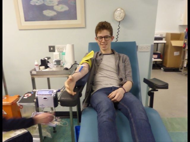 17 year old Thomas gives blood in a donor centre
