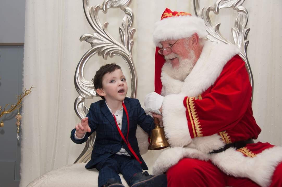 Iain smiles as he meets Santa Claus.